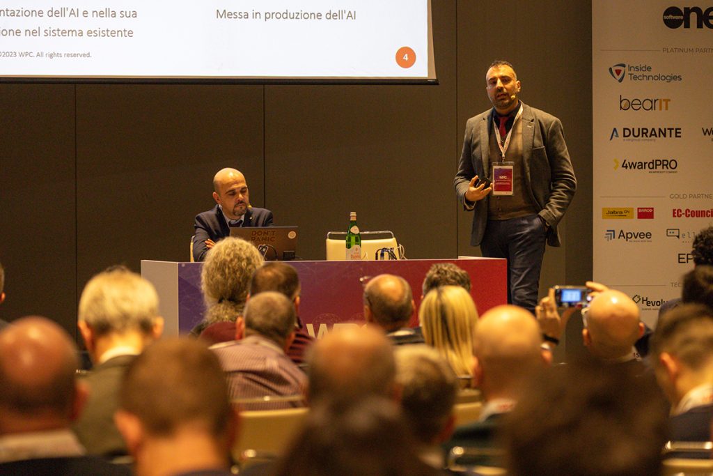 WPC 2023 - Software Foundry Manager Dario Di Toro e Marco Blonk-Steiner, Chief Technical Officer della Business Unit DevHive di BearIT sul palco del WPC 2023 per il loro speech Artificial Proficiency